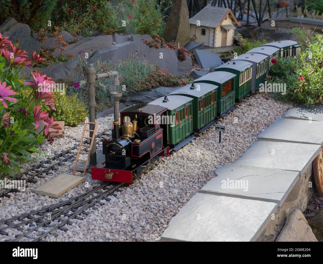 Garden Model Railway locomotive with carriages Stock Photo
