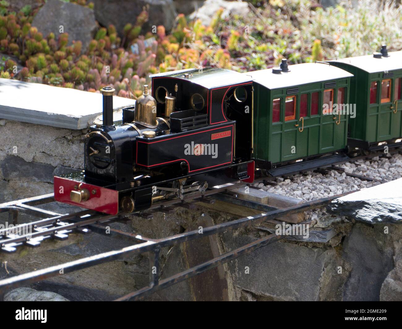 Garden Model Railway locomotive with carriages Stock Photo