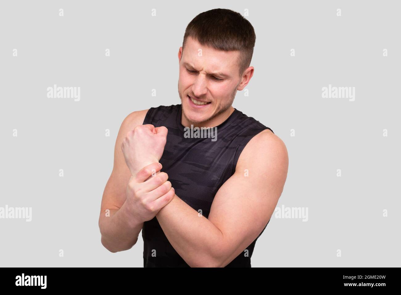 Sport man Holding Wrist. Man Having Injury. Sport man Wrist injury Stock Photo Alamy