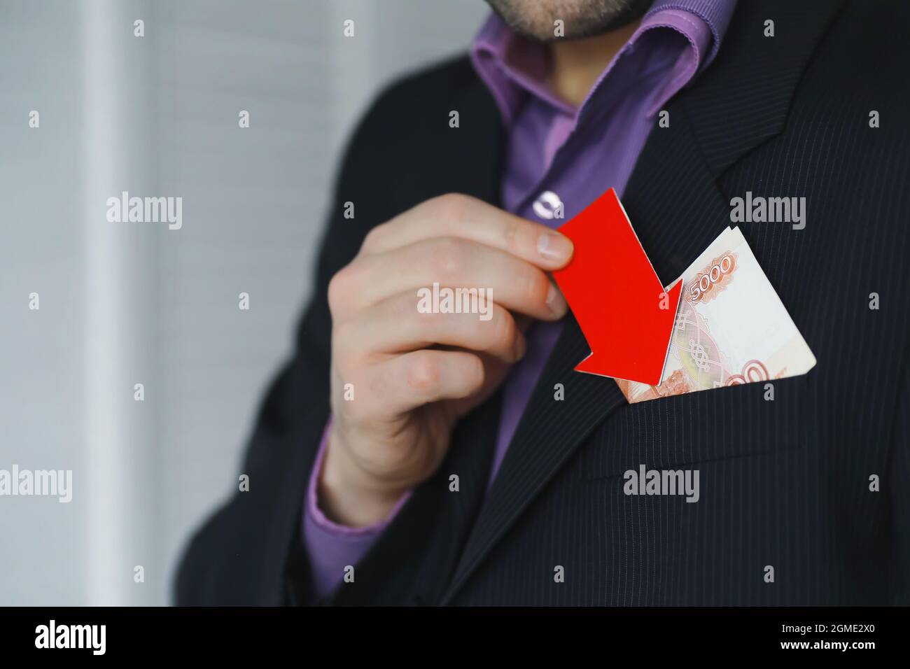 Financial crisis. Concept. Money bills in hand. Arrow symbol of fall of ...