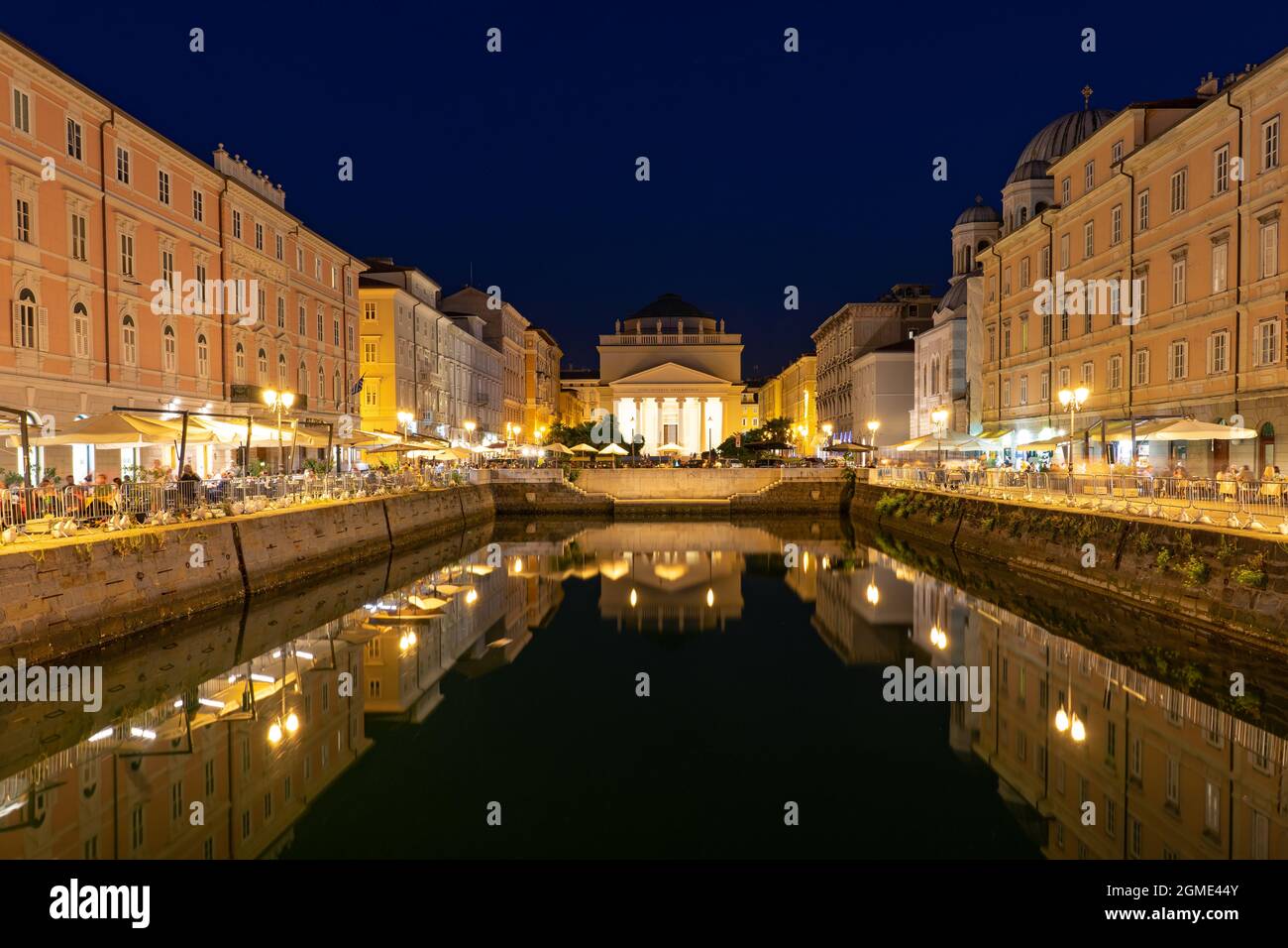 Canal Grande di Trieste at night with beautiful buildigs and refletion on the water . Stock Photo