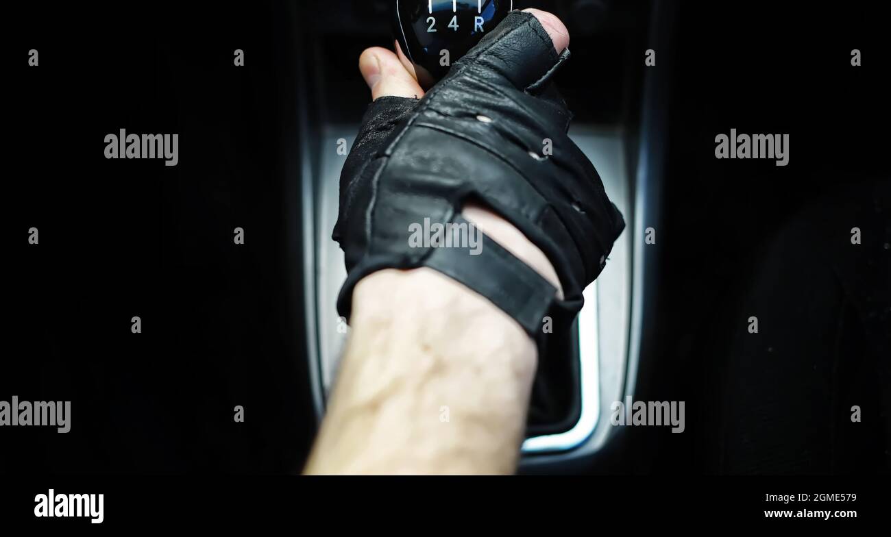 Gear lever. Manual Transmission. Hand on the gear shift in a car Stock