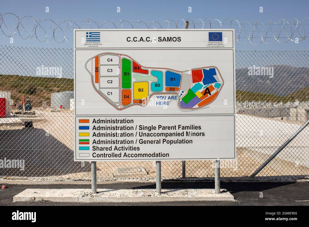 Samos, Greece. 18th Sep, 2021. A map of the newly established refugee camp on the island of Samos can be seen at the entrance to the facility. The facility is located about five kilometres from the former temporary camp near the village of Vathy and from other island villages and is surrounded by high, barbed-wire fences. Credit: Socrates Baltagiannis/dpa/Alamy Live News Stock Photo