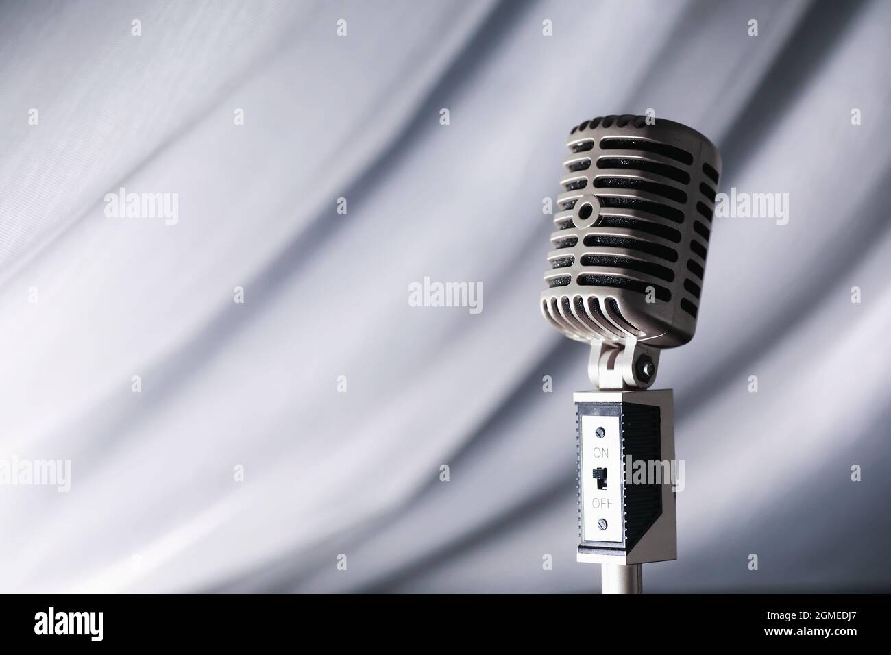 Stand with a retro microphone. Microphone on a tripod. Performance of