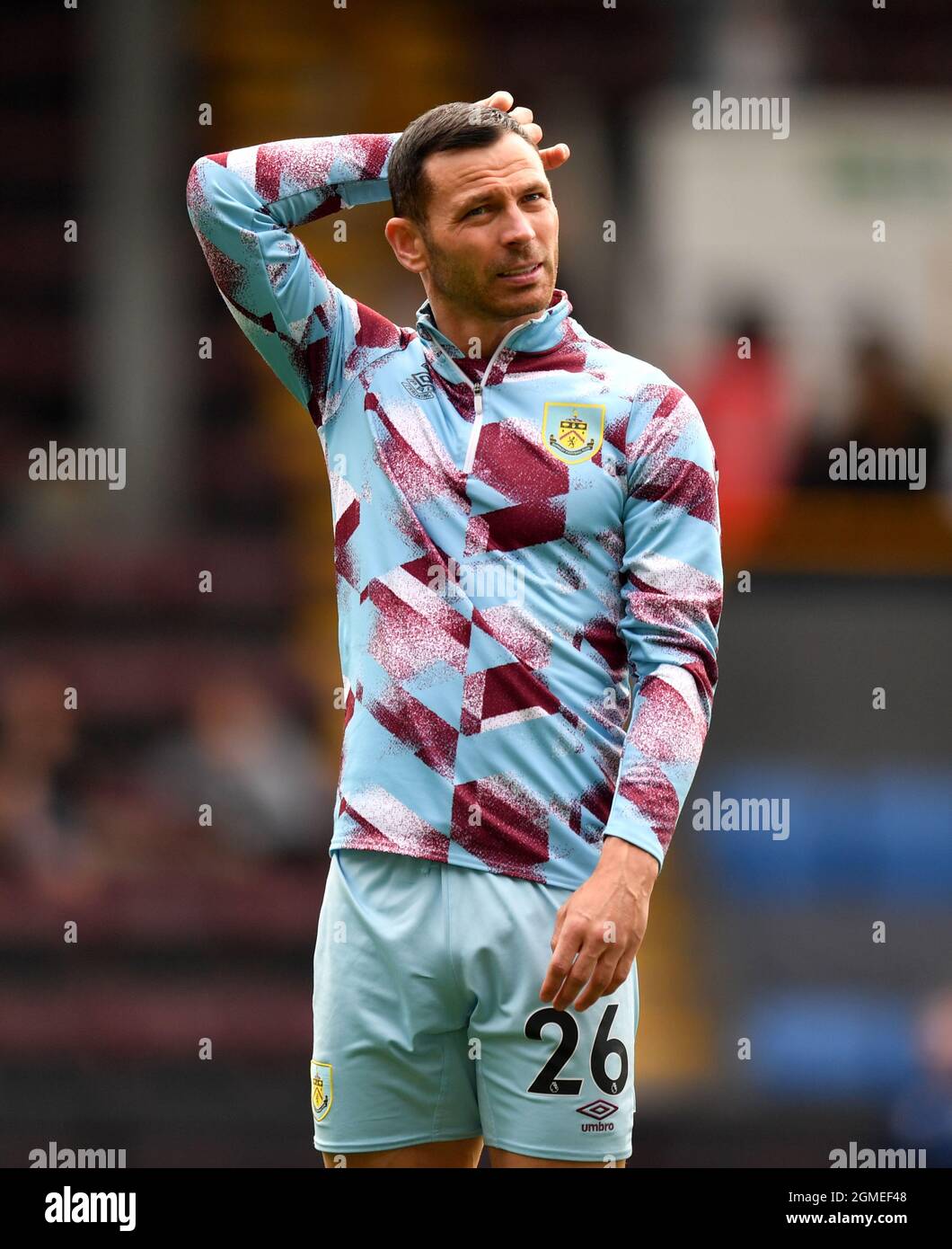 Burnley's Phil Bardsley warms up prior to the Premier League match at Turf Moor, Burnley. Picture date: Saturday September 18, 2021. Stock Photo