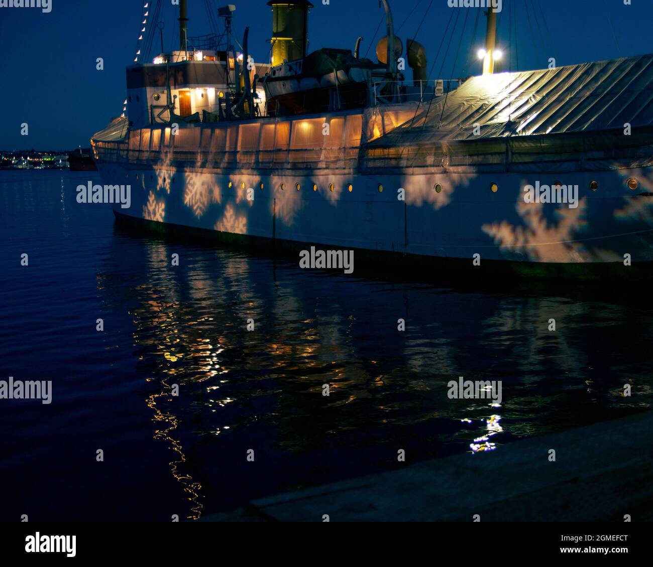 CSS Acadia at night with snow flake lights on it Stock Photo