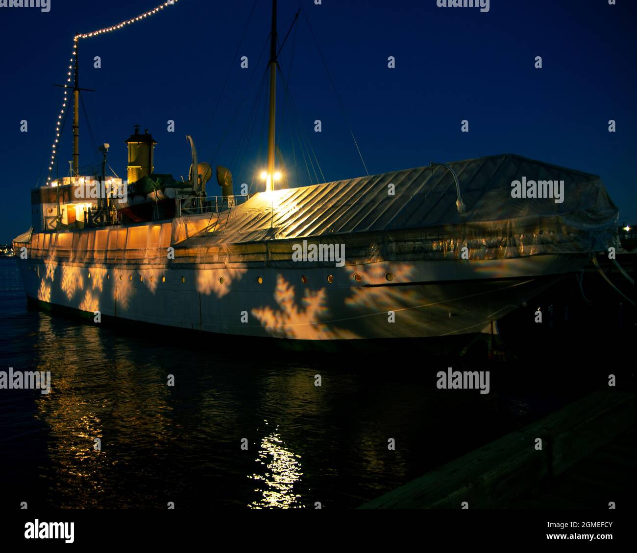 CSS Acadia at night with snow flake lights on it Stock Photo