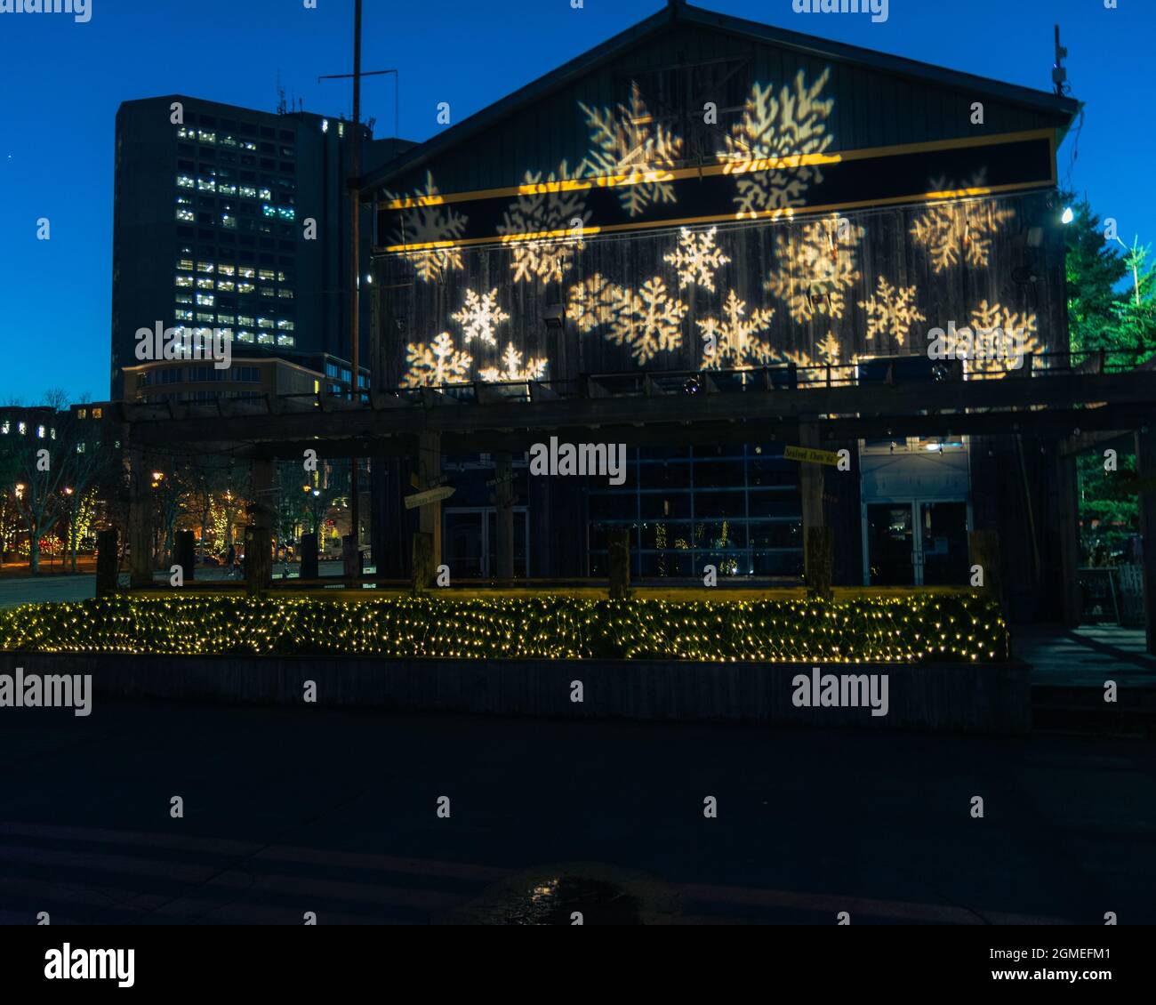 christmas lights shining on Waterfront Warehouse in halifax nova scotia during the pandemic Stock Photo