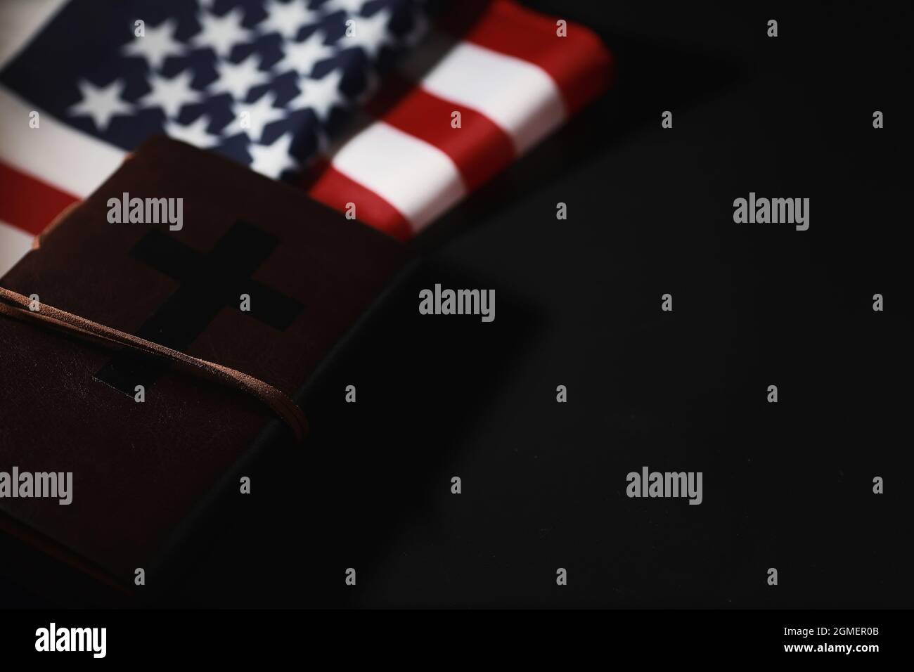 American flag and holy bible book on mirror background. Symbol of the ...