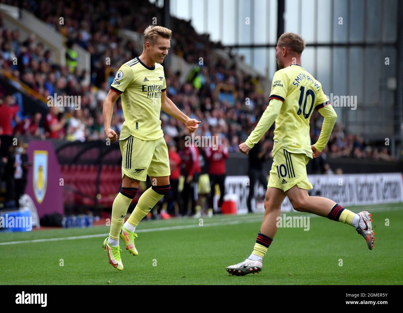 Arsenal's Martin Odegaard (left) celebrates scoring their side's first goal of the game during the Premier League match at Turf Moor, Burnley. Picture date: Saturday September 18, 2021. Stock Photo