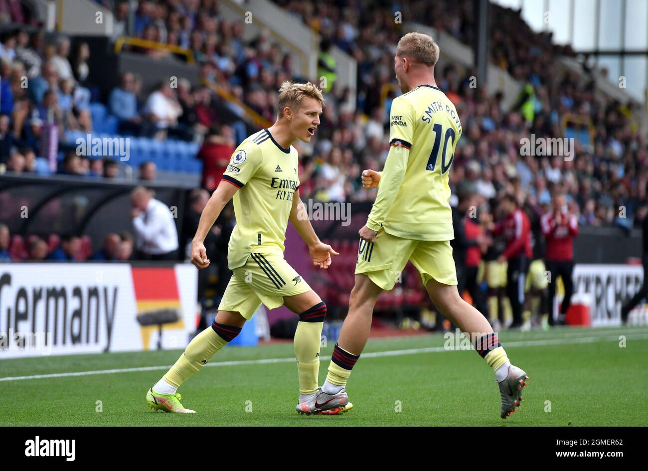 Arsenal's Martin Odegaard (left) celebrates scoring their side's first goal of the game during the Premier League match at Turf Moor, Burnley. Picture date: Saturday September 18, 2021. Stock Photo