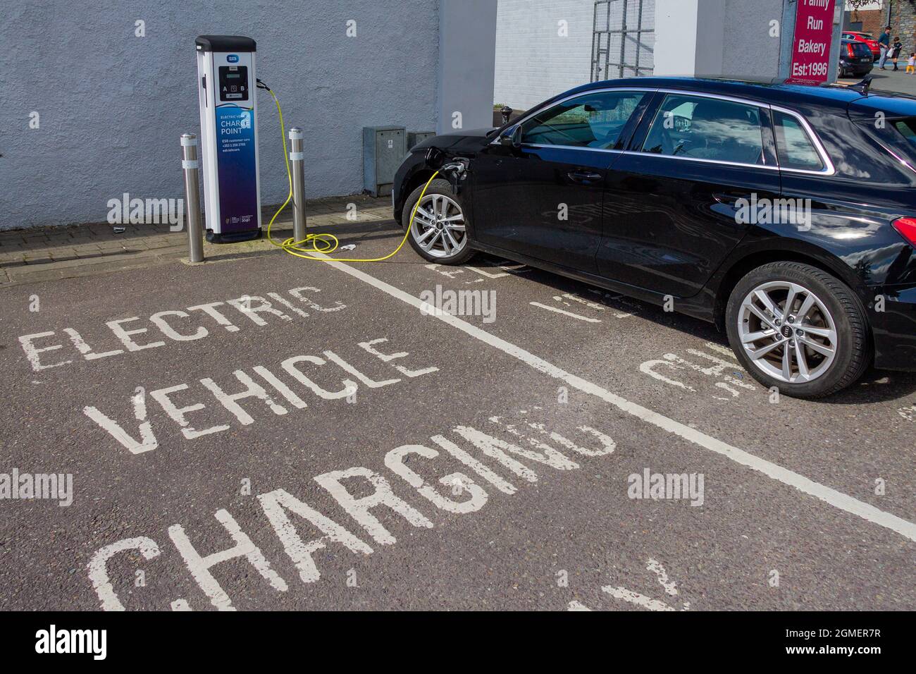 Audi E Tron at Electric Vehicle Charging Point Stock Photo