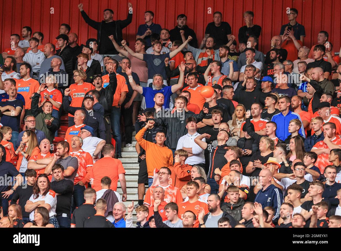 Blackpool fans sing away Stock Photo Alamy
