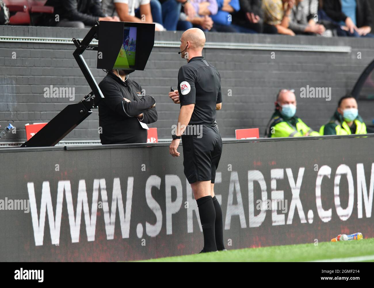 Referee Anthony Taylor views the pitch side VAR screen during the Premier League match at Turf Moor, Burnley. Picture date: Saturday September 18, 2021. Stock Photo