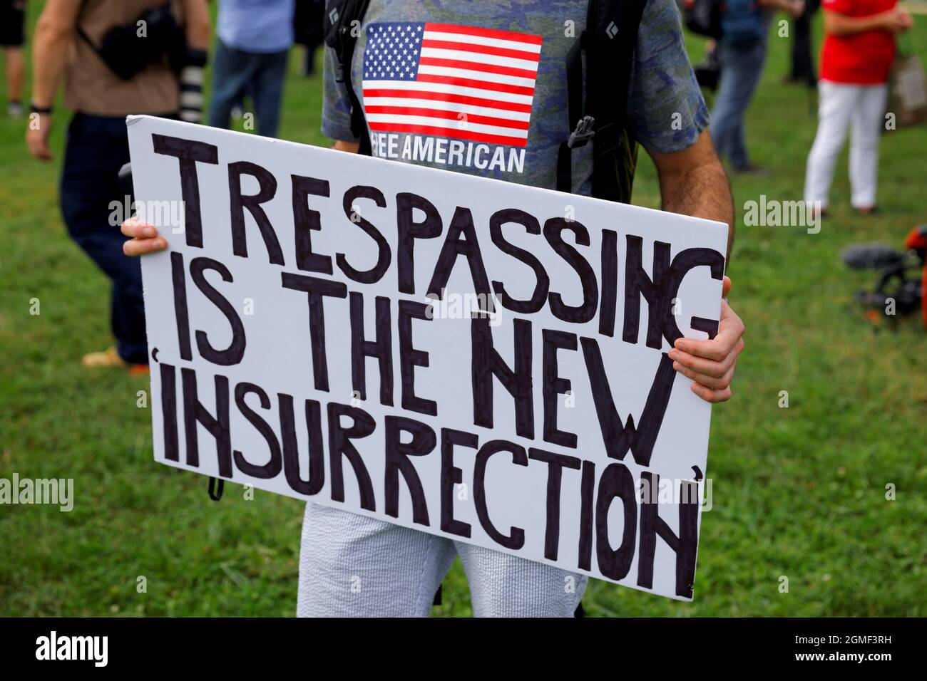 A person holds a sign on the day that supporters of defendants being prosecuted in the January 6 attack on the Capitol will hold a rally, in Washington, U.S., September 18, 2021. REUTERS/Jim Bourg Stock Photo