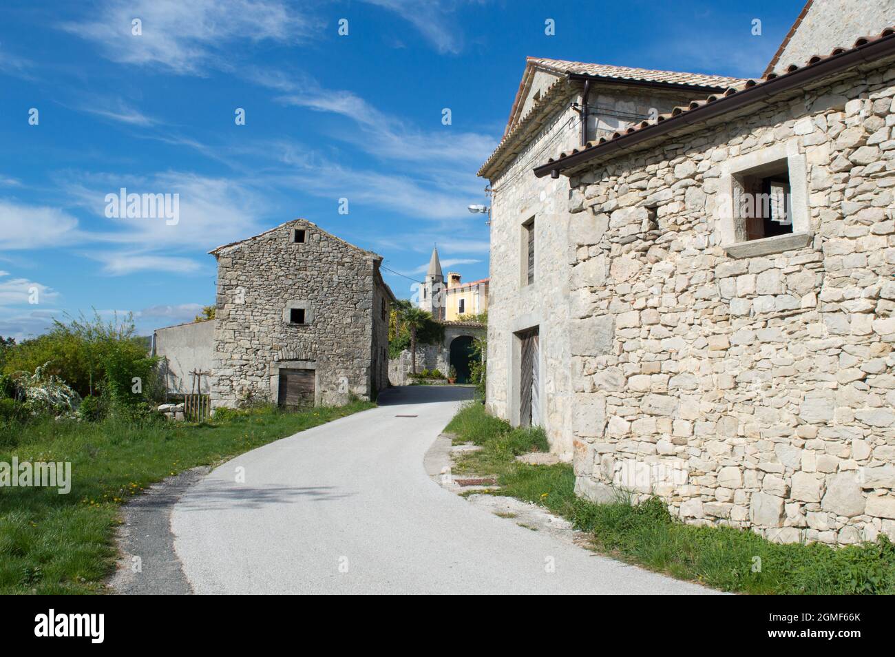Small ancient town Boljun in northeast Istria, Croatia with characteristic stone houses and a bell tower Stock Photo
