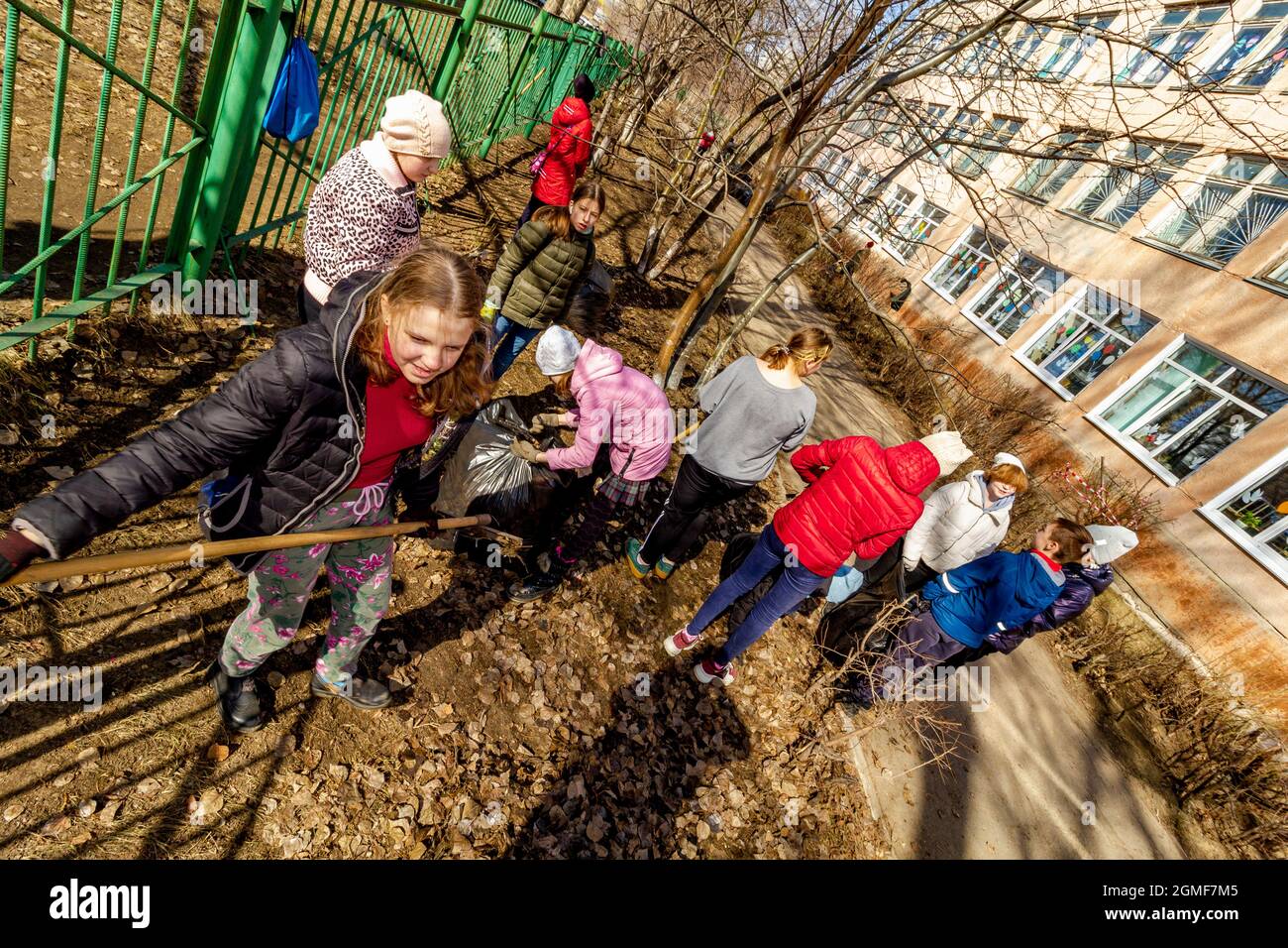 Omsk, Russia. 24 April, 2021. Top view of schoolgirls of the retractive school territory. Traditional Russian events for the preparation of school ter Stock Photo