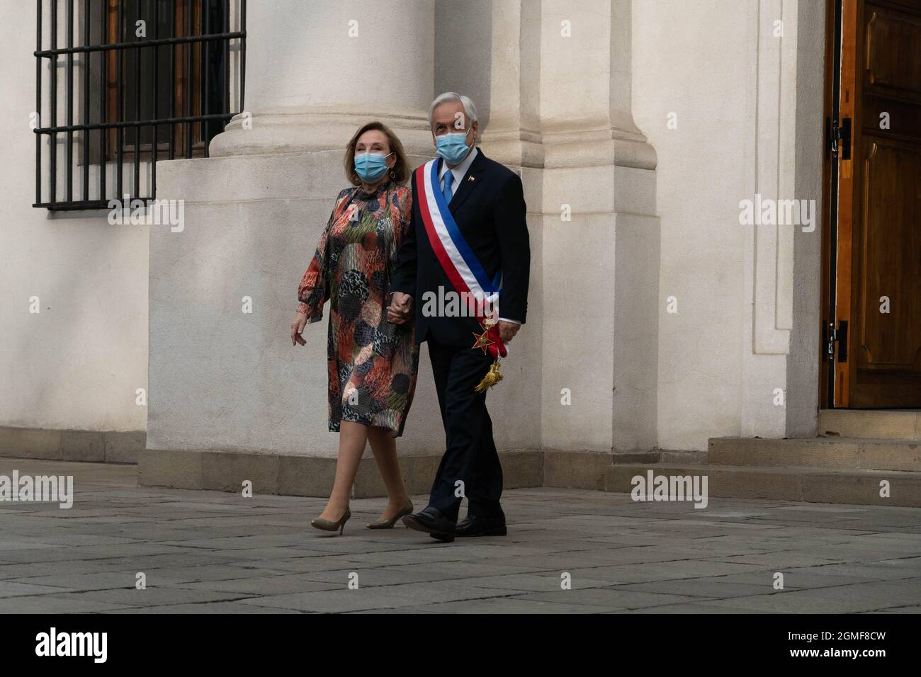 Santiago, Metropolitana, Chile. 18th Sep, 2021. President Sebastian PiÃ±era goes out to the courtyard of the La Moneda presidential palace with the first lady, to take official government photos with President PiÃ±era, on the day that Chile's independence is celebrated. September 18, 2021. (Credit Image: © Matias Basualdo/ZUMA Press Wire) Stock Photo