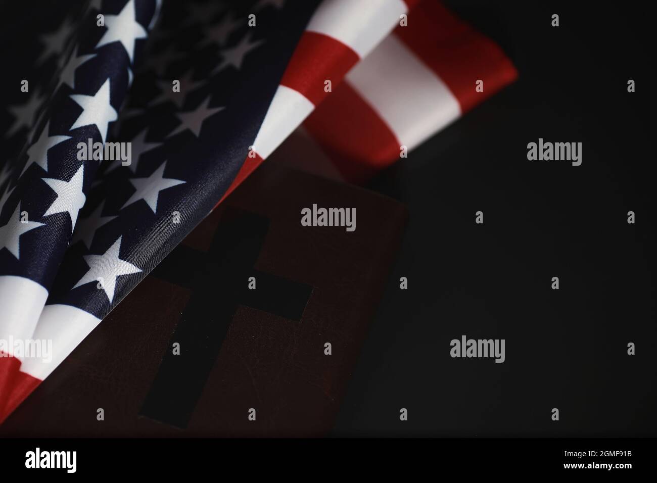 American flag and holy bible book on mirror background. Symbol of the ...