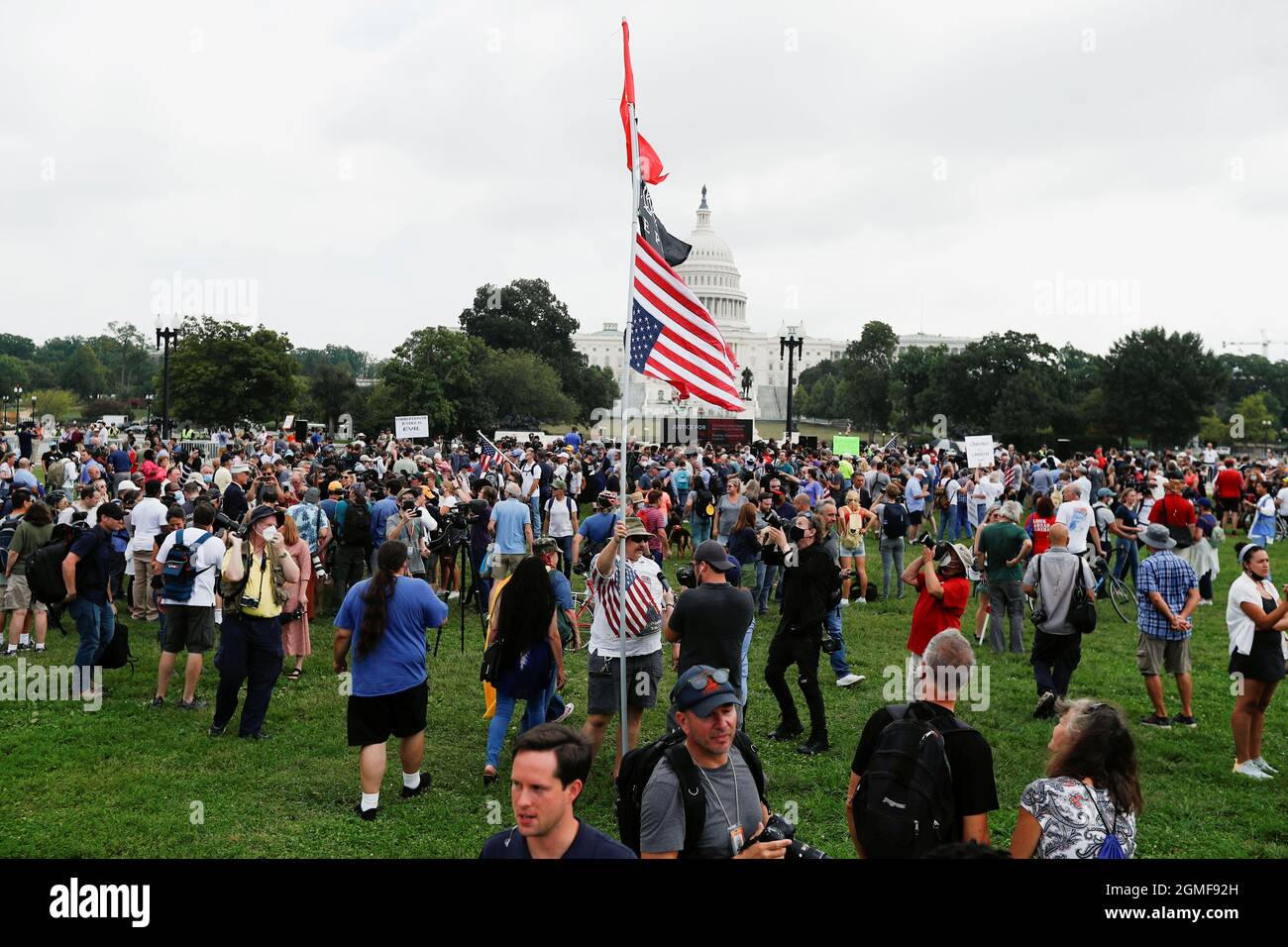 People gather in front of the U.S. Capitol during a protest in support of defendants being prosecuted in the January 6 attack on the Capitol, in Washington, U.S., September 18, 2021. REUTERS/Jim Bourg Stock Photo