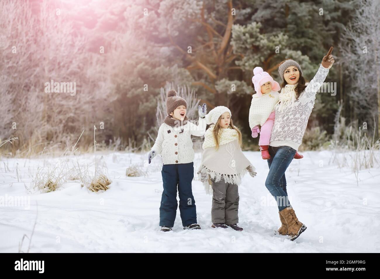 Happy Family Playing And Laughing In Winter Outdoors In Snow City Park Winter Day Stock Photo Alamy