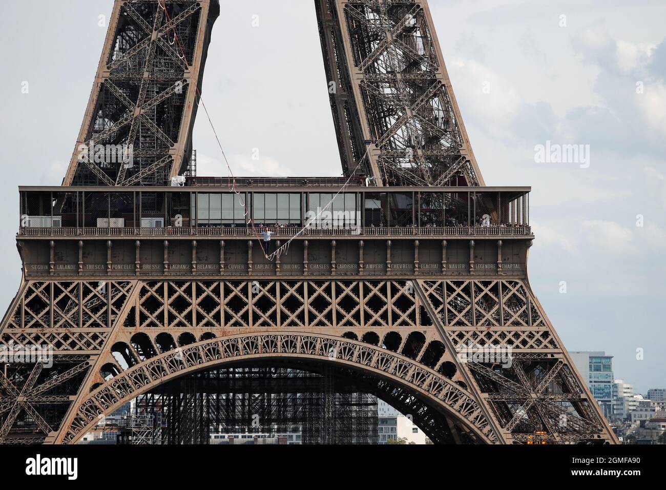 French acrobat Nathan Paulin walks on a slackline between the Eiffel