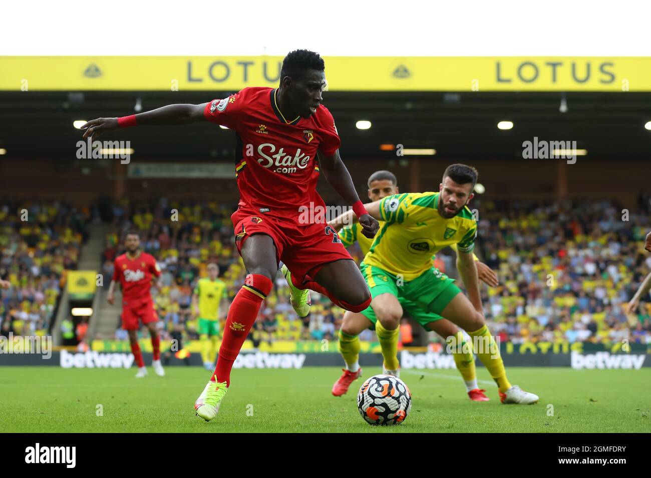 Carrow Road, Norwich, UK. 18th Sep, 2021. Premier League football Norwich City versus Watford; Isma&#xef;la Sarr of Watford under pressure from Grant Hanley of Norwich City Credit: Action Plus Sports/Alamy Live News Stock Photo