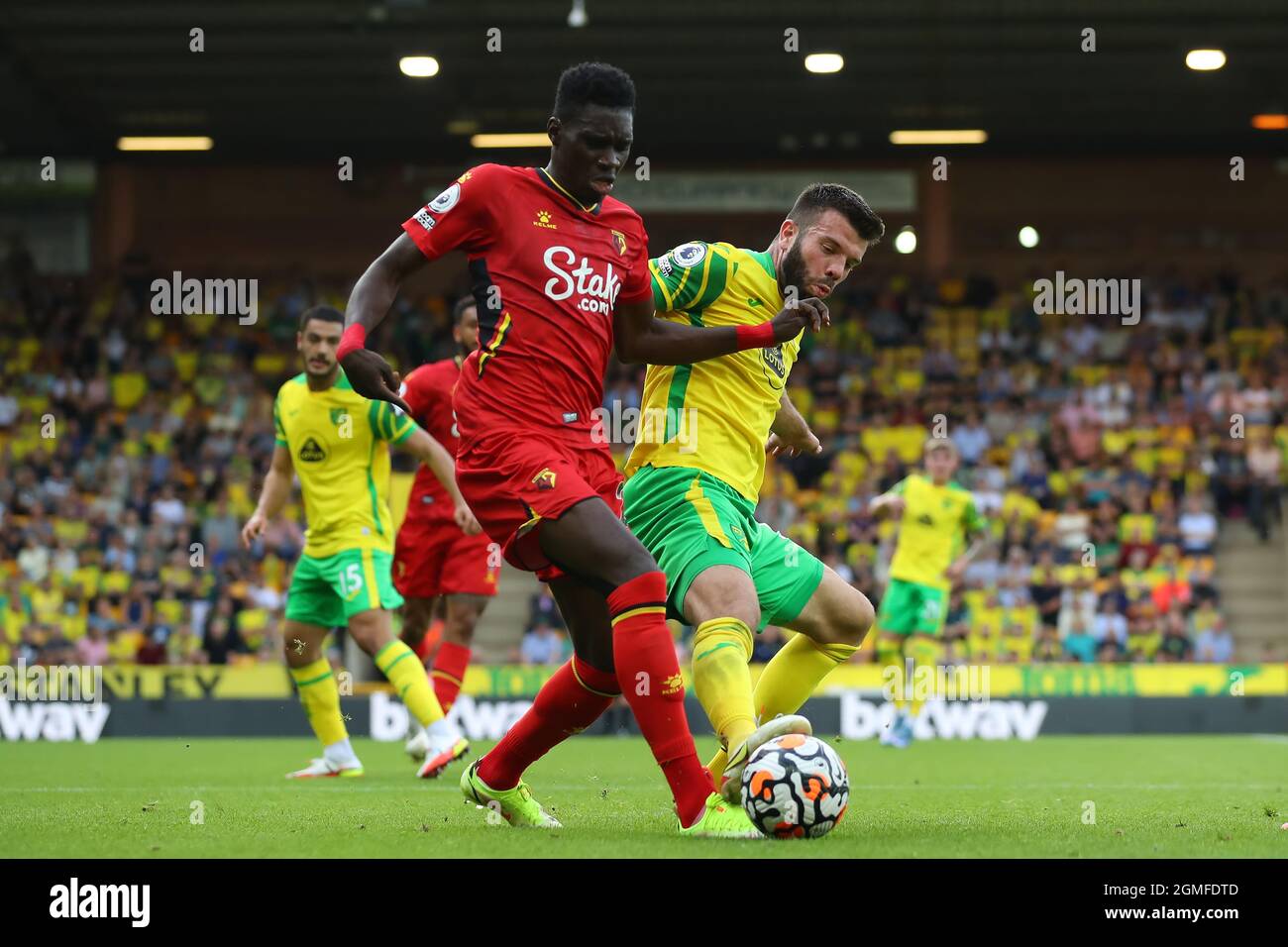 Carrow Road, Norwich, UK. 18th Sep, 2021. Premier League football Norwich City versus Watford;Grant Hanley of Norwich City challenges Isma&#xef;la Sarr of Watford Credit: Action Plus Sports/Alamy Live News Stock Photo