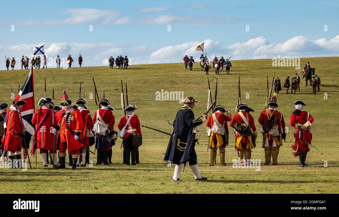 Prestonpans, East Lothian, Scotland, UK, 18 September 2021 Battle of Prestonpans re-enactment: The battle of Prestonpans in 1745 was one of the shortest battles in British history but It was a complete victory for Prince Charles Edward Stuart's Jacobite force against the Hanoverian army led by Sir John Cope. Pictured: The Hanoverian forces (or redcoats) face the Jacobite army Stock Photo