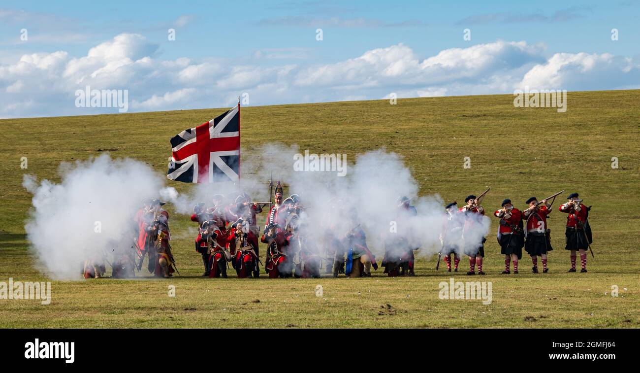 Prestonpans, East Lothian, Scotland, UK, 18 September 2021 Battle of Prestonpans re-enactment: The battle of Prestonpans in 1745 was one of the shortest battles in British history. Pictured: The Hanoverian army or redcoats fire their guns Stock Photo