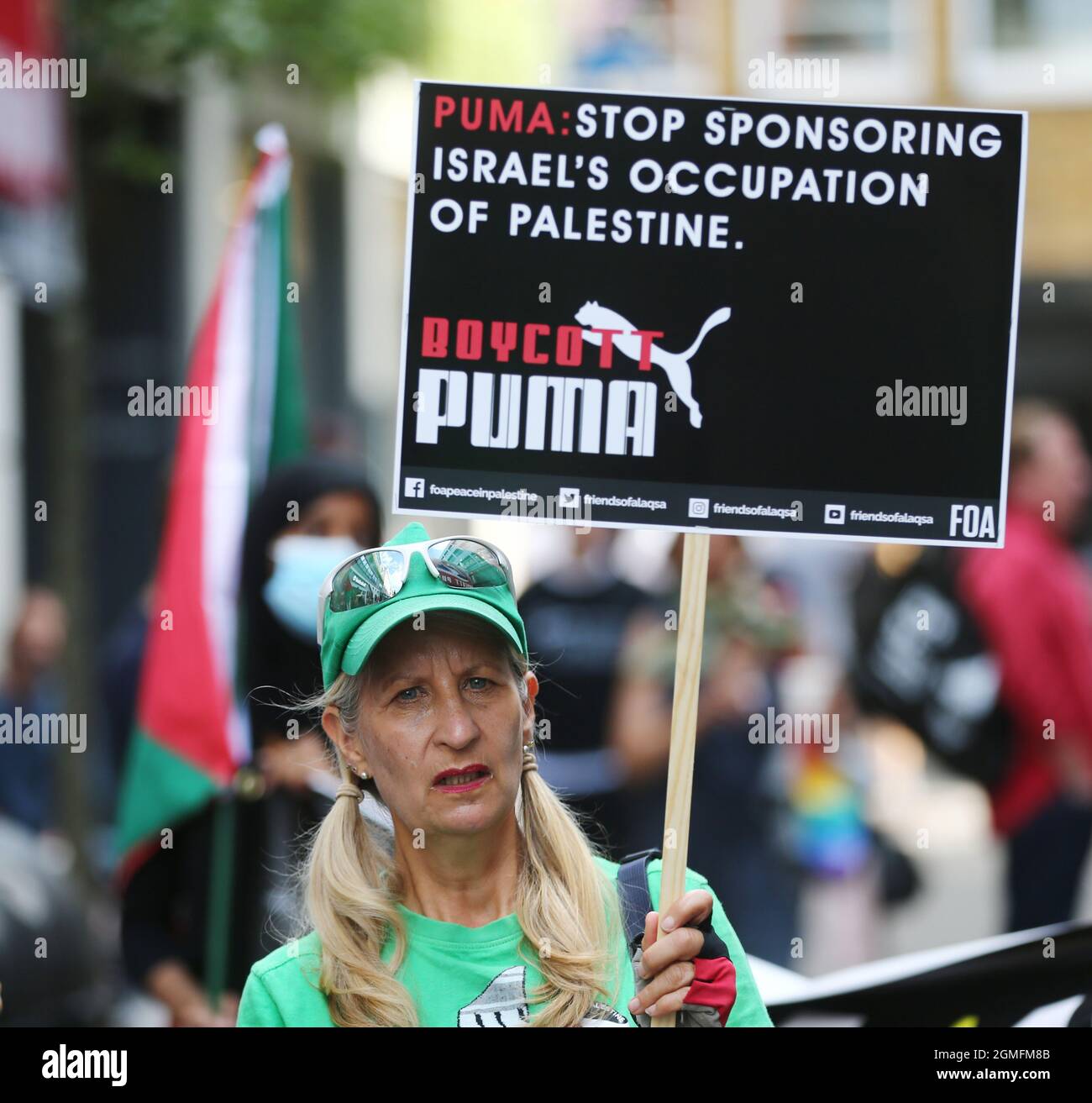 London, England, UK. 18th Sep, 2021. Pro-Palestine protesters stage a demonstration outside Carnaby Street branch of sportswear brand Puma in London. Protesters call for a boycott of the company's products claiming by its sponsorship of Israeli Football Association it supports occupation of Palestinian soli. (Credit Image: © Tayfun Salci/ZUMA Press Wire) Stock Photo