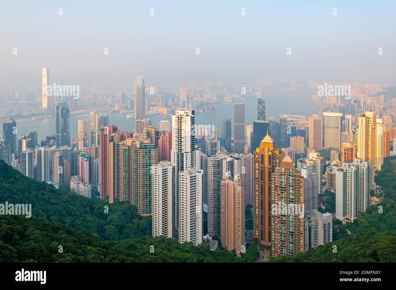 Hong Kong city skyline with fog at sunset, China. Stock Photo
