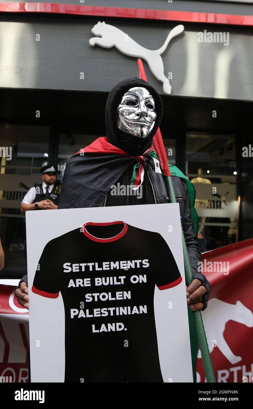 London, England, UK. 18th Sep, 2021. Pro-Palestine protesters stage a demonstration outside Carnaby Street branch of sportswear brand Puma in London. Protesters call for a boycott of the company's products claiming by its sponsorship of Israeli Football Association it supports occupation of Palestinian soli. (Credit Image: © Tayfun Salci/ZUMA Press Wire) Stock Photo