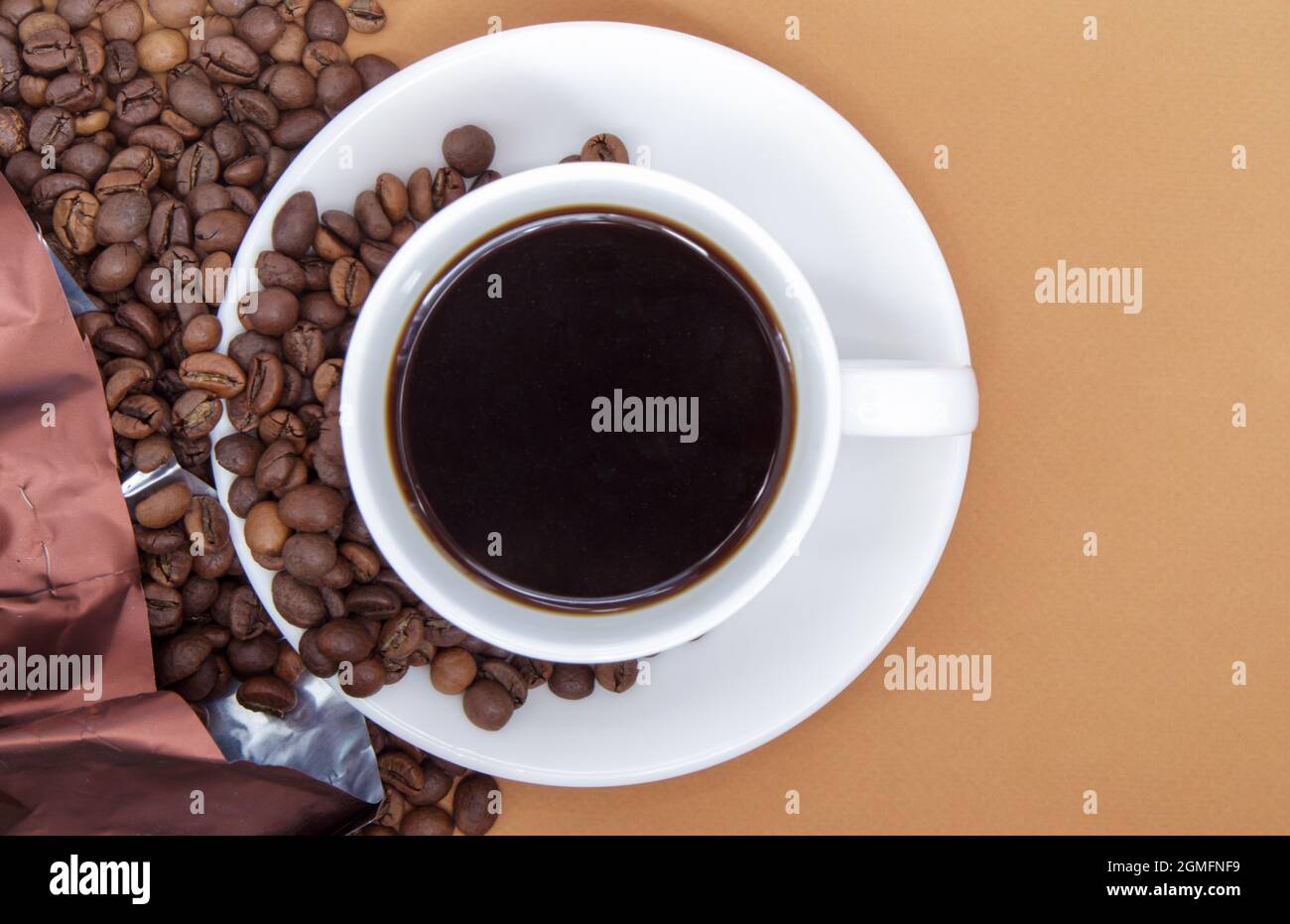 White Cup Of Americano Black Coffee Without Milk With A Bunch Of Roasted Coffee Beans Scattered From Paper Packaging Coffee Background Top View With Stock Photo Alamy