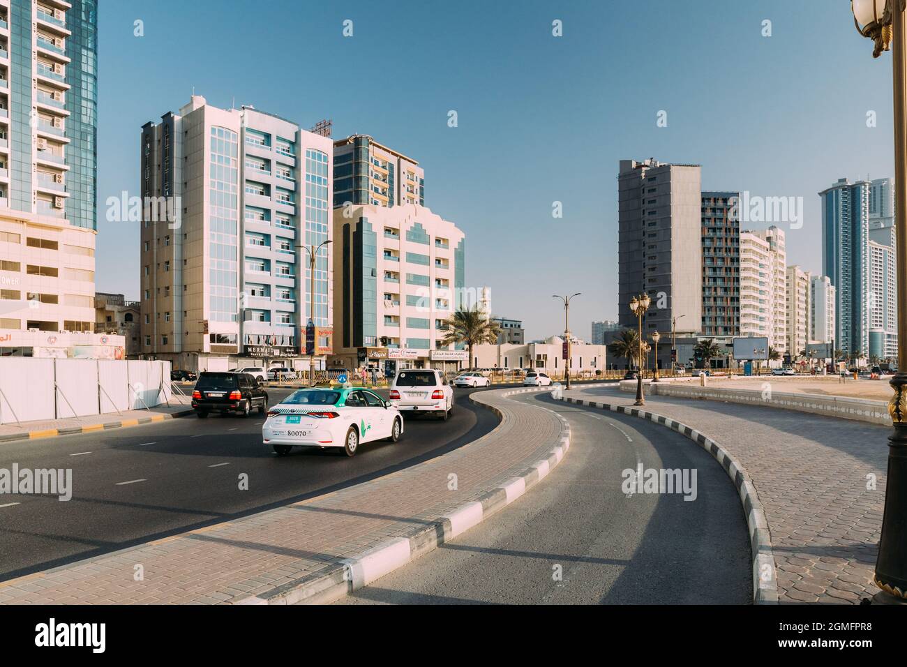 Toyota Taxi Car Moving In Street Of City Of Ajman Stock Photo