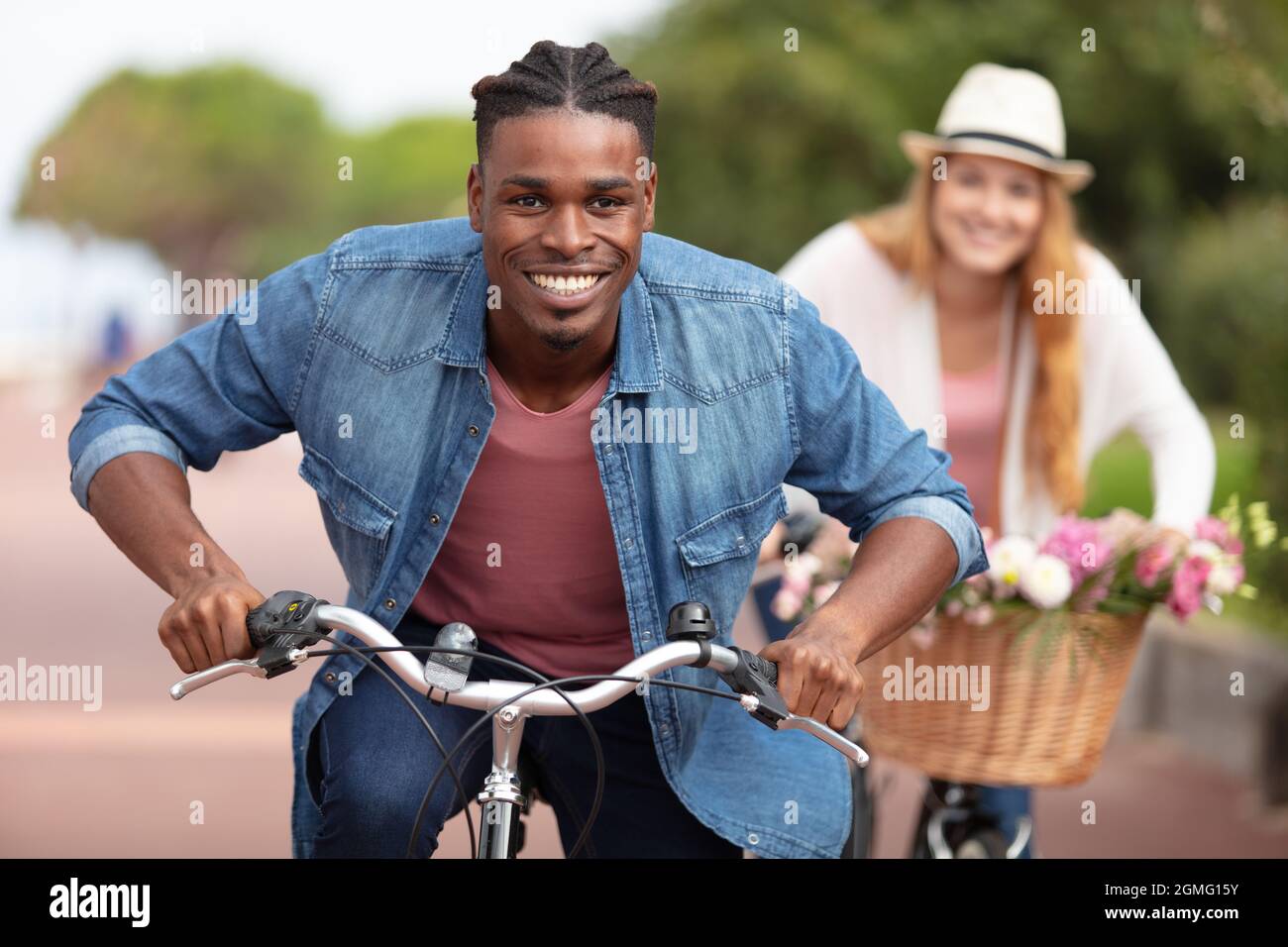 couple having a bicycles race into the nature Stock Photo