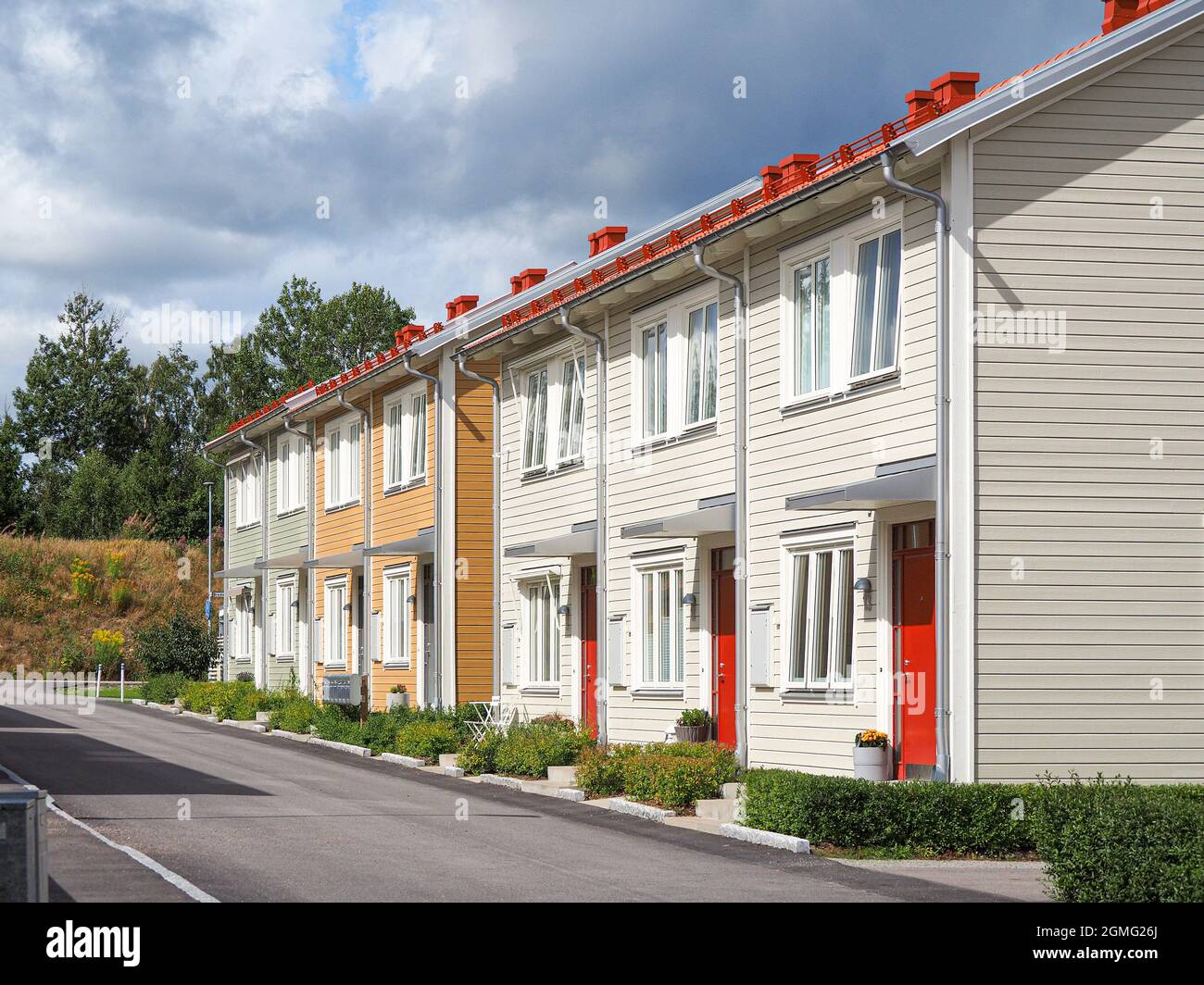 Image showcasing Street with Scandinavian style townhouses or condominium apartments ...