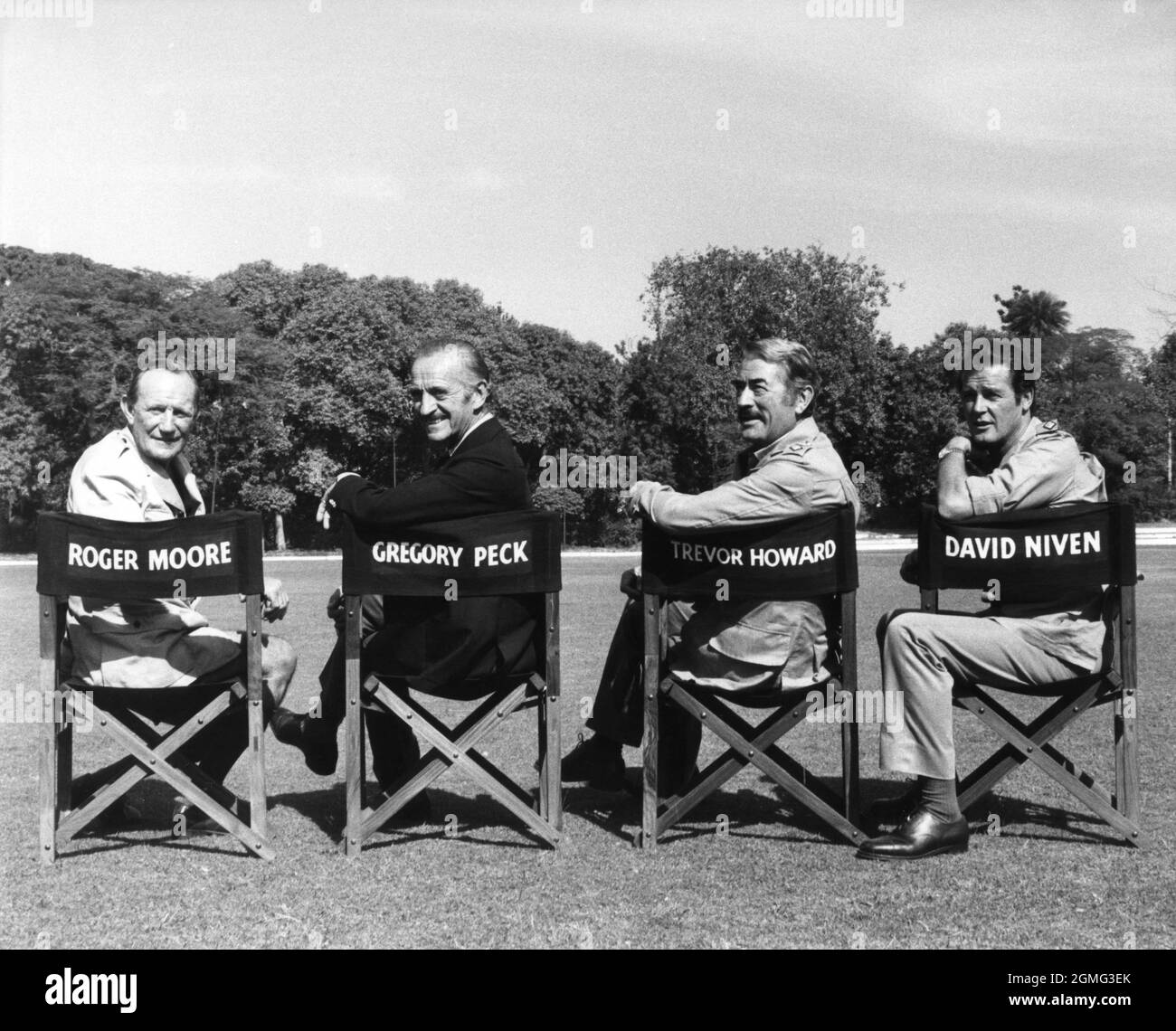 TREVOR HOWARD DAVID NIVEN GREGORY PECK and ROGER MOORE on set location candid portrait during filming of THE SEA WOLVES 1980 director ANDREW V. McLAGLEN book Boarding Party by James Leasor screenplay Reginald Rose producer Euan Lloyd Switzerland - UK - USA co-production Lorimar Productions / Richmond Light Horse Productions / Varius Entertainment Trading A.G. / Rank Film Distributors Stock Photo