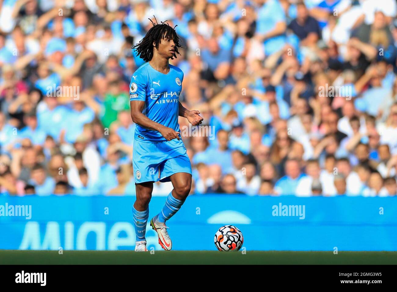Nathan Ake #6 of Manchester City runs with the ball Stock Photo