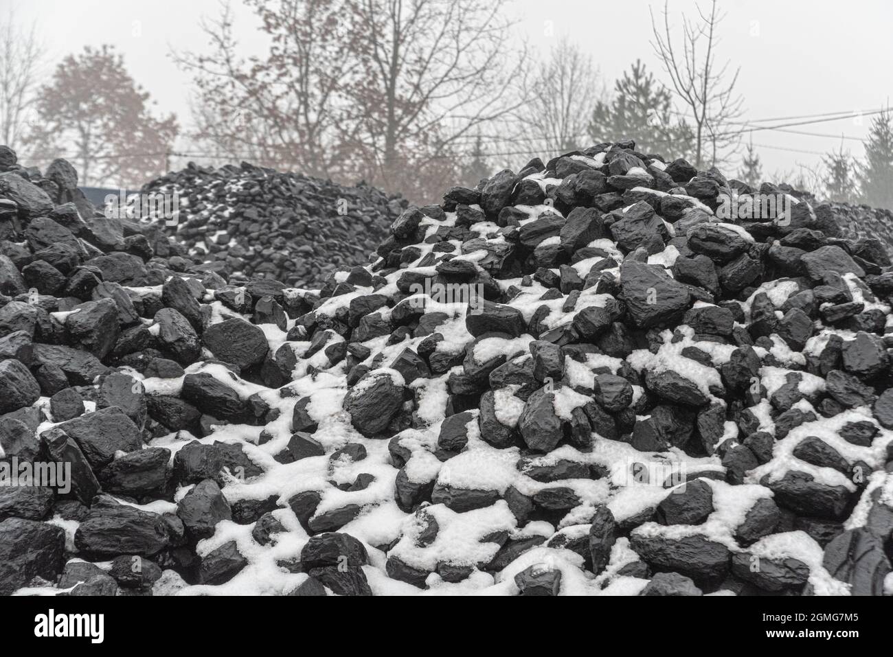 Coal and snow. Fuel composition in winter. Hard coal for sale. Fuel for
