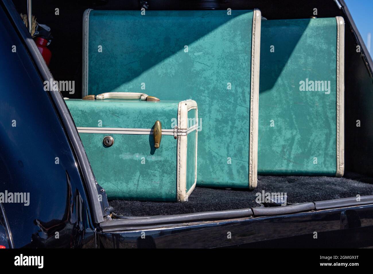 Vintage Suitcases in old Car Trunk Stock Photo