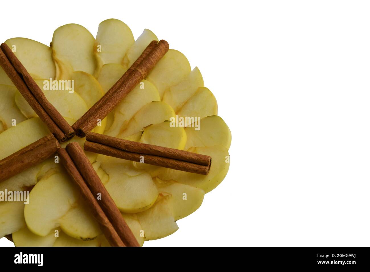 Sliced white apples and cinnamon lined with a circle and a star on a white background Stock Photo
