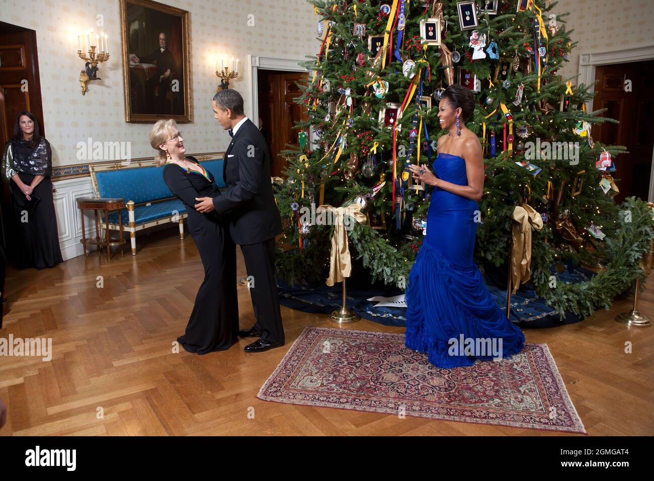 President Barack Obama and First Lady Michelle Obama greet Kennedy Center Honoree Meryl Streep in the Blue Room of the White House, Dec. 4, 2011. (Official White House Photo by Lawrence Jackson) This official White House photograph is being made available only for publication by news organizations and/or for personal use printing by the subject(s) of the photograph. The photograph may not be manipulated in any way and may not be used in commercial or political materials, advertisements, emails, products, promotions that in any way suggests approval or endorsement of the President, the First Fa Stock Photo