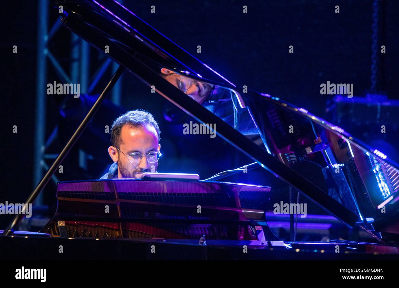 Jamel, Germany. 18th Sep, 2021. Star pianist Igor Levit plays at the concert 'Jamel rocks the forester' in the small village of Jamel near Wismar. The nationally known festival is a sign of civil society commitment against the strong neo-Nazi scene in the village. Credit: Jens Büttner/dpa-Zentralbild/dpa/Alamy Live News Stock Photo