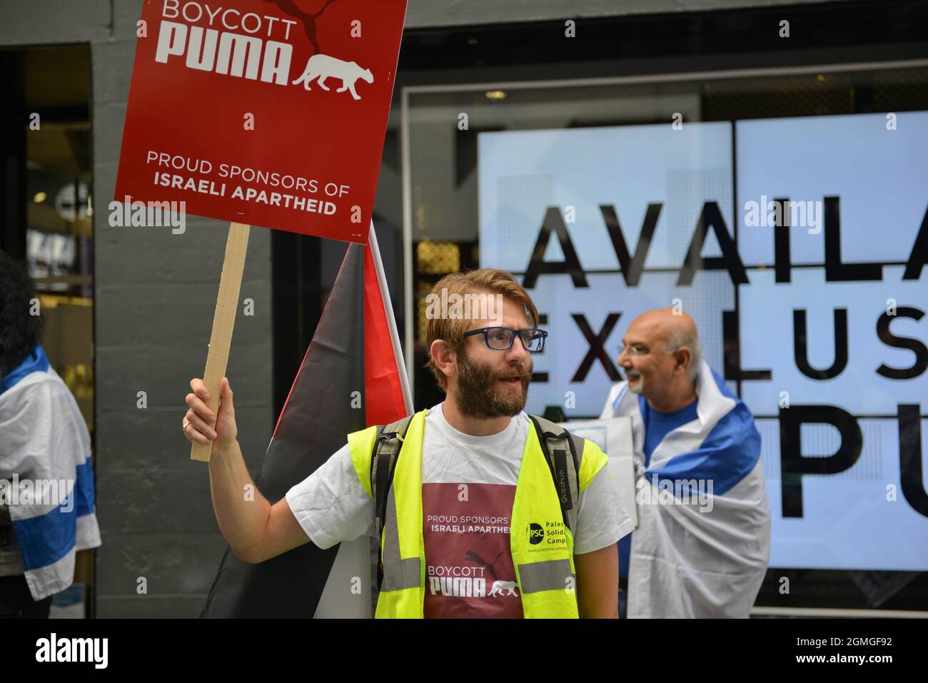 London, UK. 18th Sep, 2021. A protestor holding a placard expressing his opinion, during the demonstration.Boycott Puma protest organised by Palestine Solidarity Campaign and FOA (Friends of Al Aqsa) at Puma flagship store on Carnaby Street, London. Activists demonstrated against Puma's sponsorship of the IFA (Israel Football Association). Credit: SOPA Images Limited/Alamy Live News Stock Photo