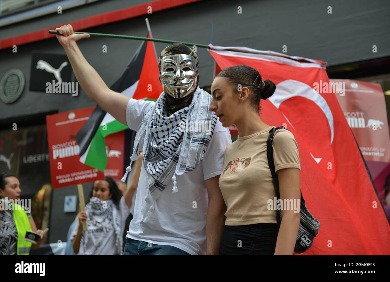 London, UK. 18th Sep, 2021. Two protesters with a Turkish flag during the demonstration.Boycott Puma protest organised by Palestine Solidarity Campaign and FOA (Friends of Al Aqsa) at Puma flagship store on Carnaby Street, London. Activists demonstrated against Puma's sponsorship of the IFA (Israel Football Association). Credit: SOPA Images Limited/Alamy Live News Stock Photo
