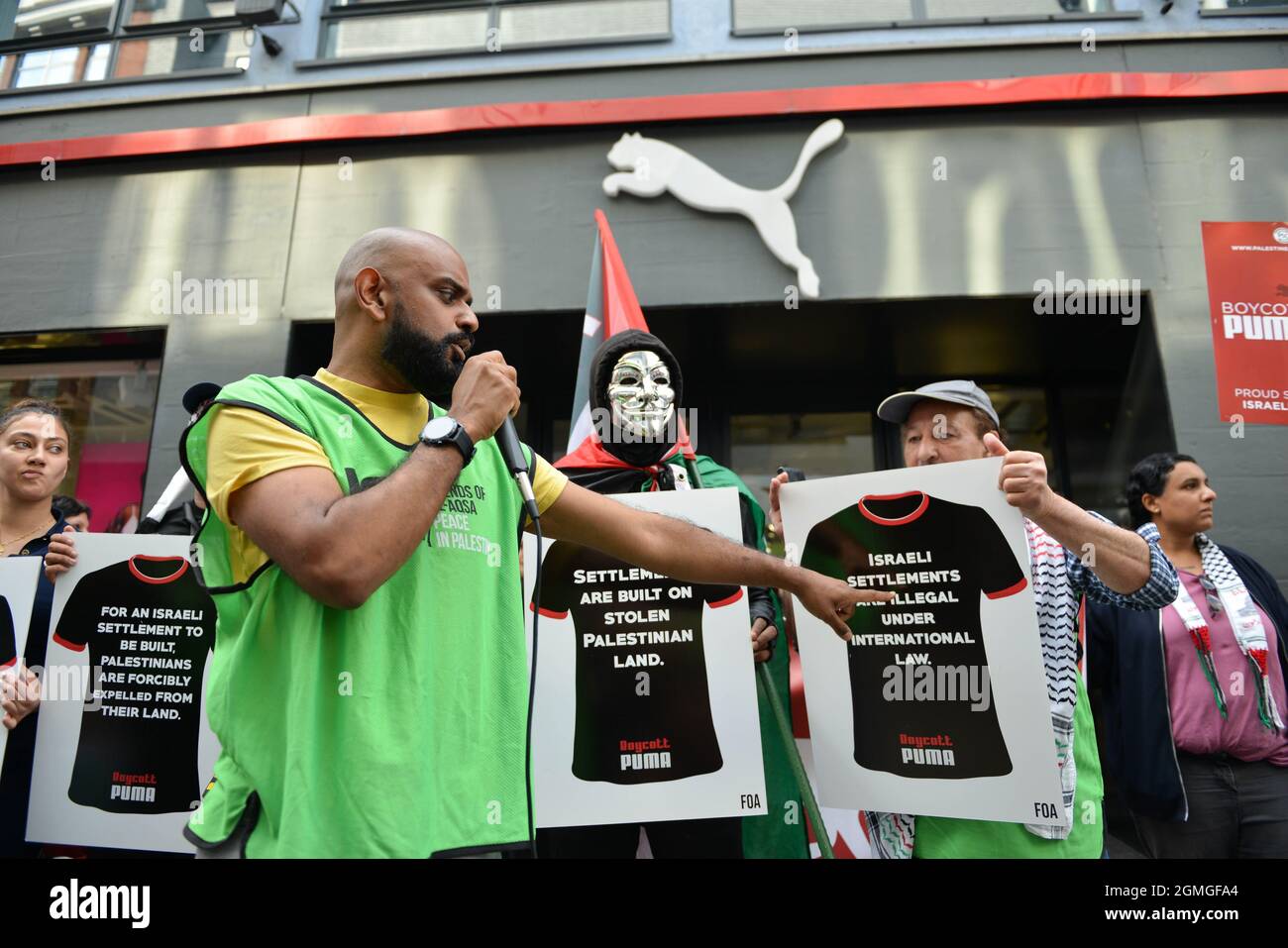 London, UK. 18th Sep, 2021. A protester speaking on a microphone, during the demonstration.Boycott Puma protest organised by Palestine Solidarity Campaign and FOA (Friends of Al Aqsa) at Puma flagship store on Carnaby Street, London. Activists demonstrated against Puma's sponsorship of the IFA (Israel Football Association). Credit: SOPA Images Limited/Alamy Live News Stock Photo