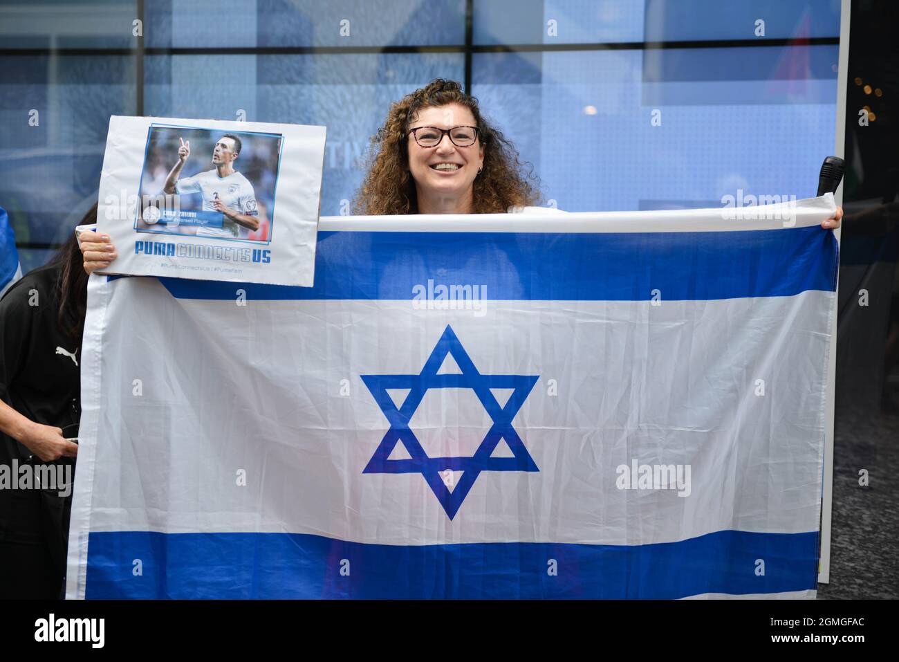London, UK. 18th Sep, 2021. A counter protester with an Israeli flag during the demonstration.Boycott Puma protest organised by Palestine Solidarity Campaign and FOA (Friends of Al Aqsa) at Puma flagship store on Carnaby Street, London. Activists demonstrated against Puma's sponsorship of the IFA (Israel Football Association). Credit: SOPA Images Limited/Alamy Live News Stock Photo