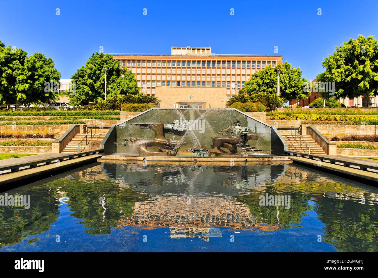Public building of war memorial in downtown of Newcastle city with standing pool and fountain, NSW, Australia. Stock Photo