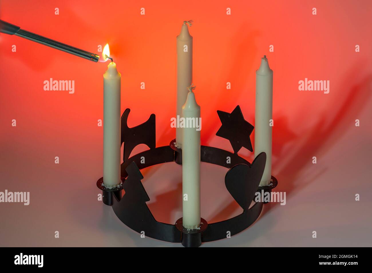 Close up view of man lights first candle in traditional candlesticks of
